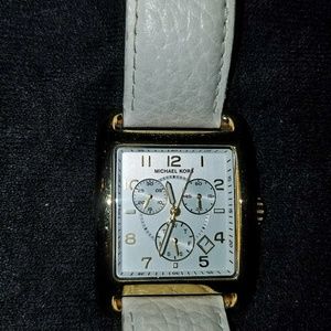 MK women's watch with gold tone framed face